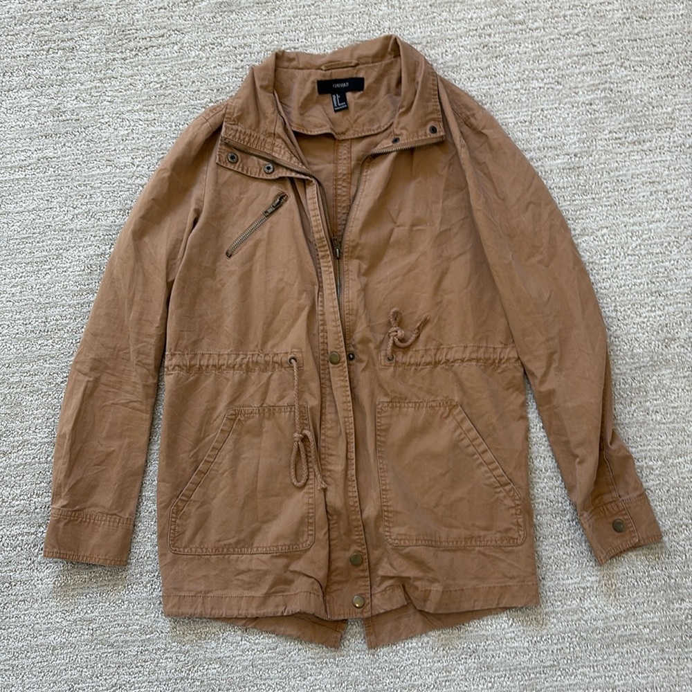 Woman’s khaki colored long jacket